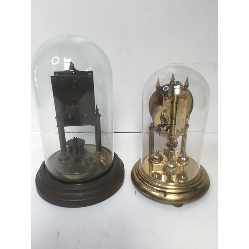 944 - Two glass domed clocks in need of repair