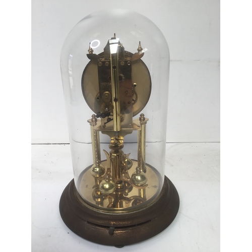 945 - Glass domed clock working when booked in