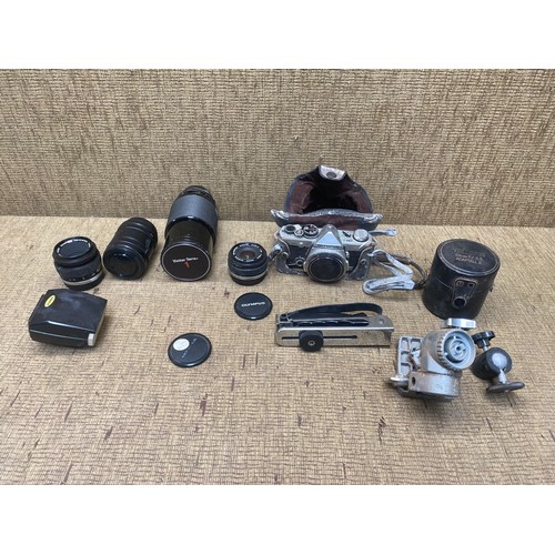 1078 - Olympus OM-2 film camera and a selection of lenses including: Vivitar series and olympus lenses,