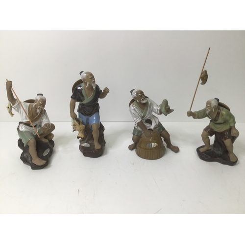 601 - Four Chinese fishermen figurines