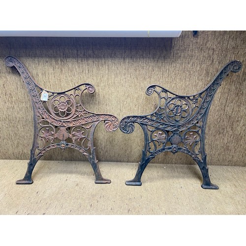 43 - 2 cast iron bench ends .