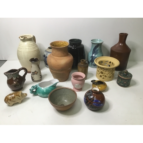 59 - A selection of handmade pottery jugs and pots