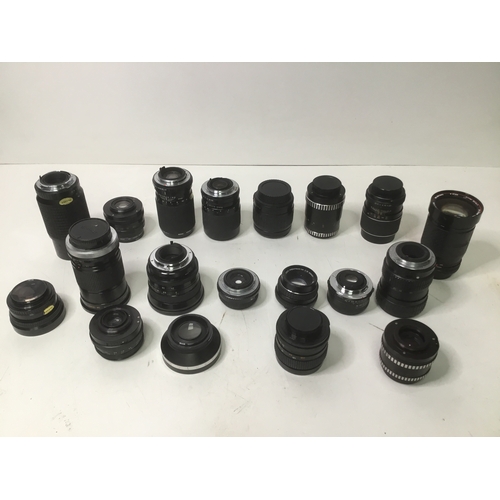 64 - Large amount of camera lenses including Canon, Vivitar, Meyer and Pentax