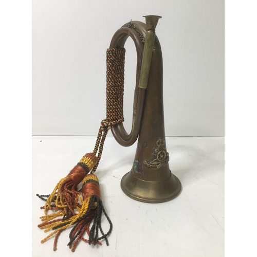 622 - Copper and brass bugle with a Royal artillery badge to the front