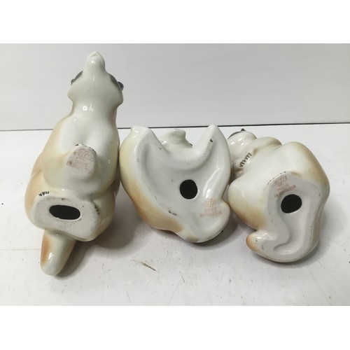 620 - Three vintage Russian porcelain raccoon figures