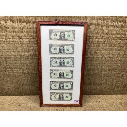 428 - Collection of six consecutive star US 1 one dollar notes in a frame.