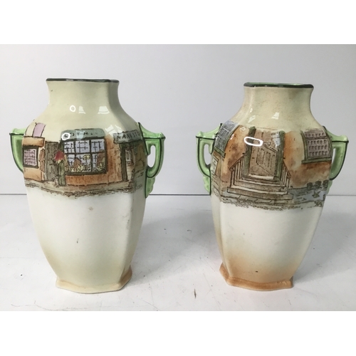 641 - A pair of Royal Doulton vases 18cm high with Dickens’ characters