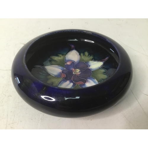 643 - Small Moorcroft inverted rim pottery bowl with Columbine pattern