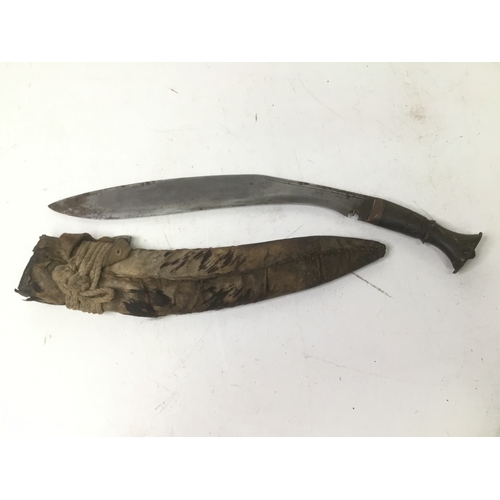 701 - Indian kukri knife in a protective sheath