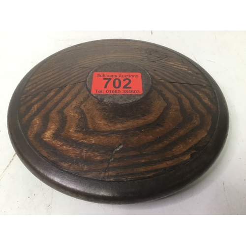 702 - An early discus from the 1930’s made from oak with a steel band