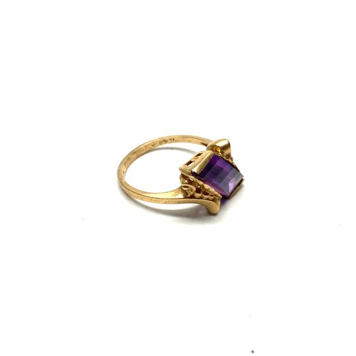 887 - 9ct gold ring with large purple amethyst stone and stunning mount size M and 2.8g.