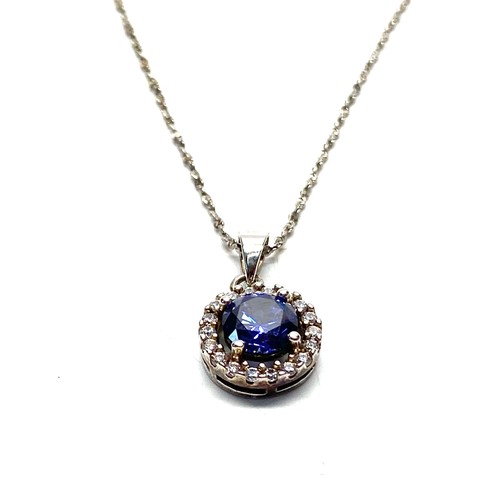 900 - Silver pendant with dazzling blue stone.