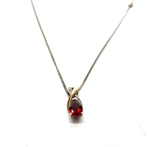 905 - Pretty 9ct gold and silver mixed pendant with a ruby and chain.