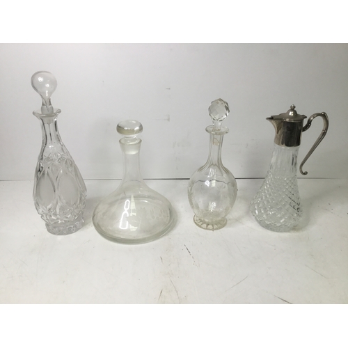 470 - Three decanters and a claret jug