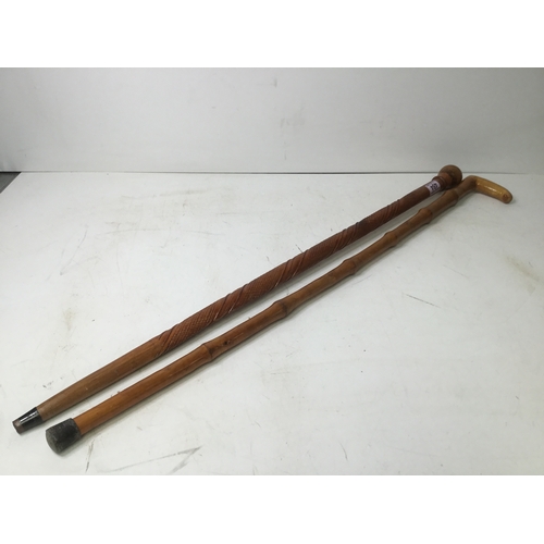 484 - Two wooden walking sticks