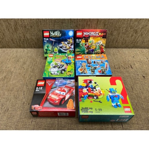 1122 - Collection of boxed LEGO sets including: Cars 2, Monster fighters, Legends of Chima and DC.