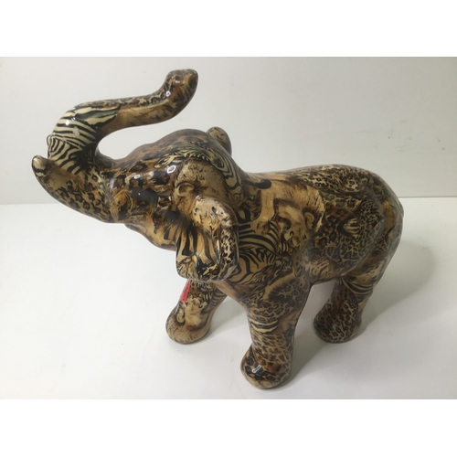 648 - Lovely crockery Elephant decorated with leopards and zebras 27cm