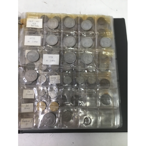 855 - A folder of world coins including UK, Belgium, Italy and others see all pictures