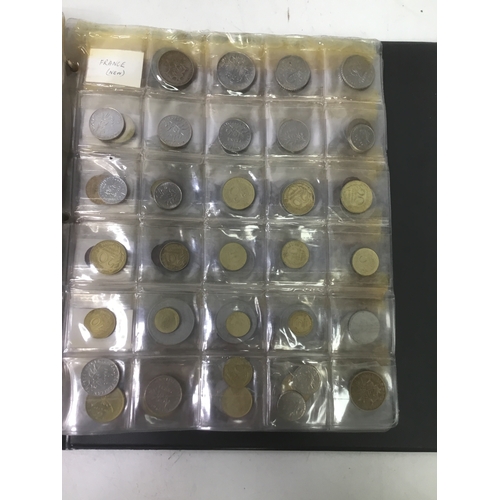 855 - A folder of world coins including UK, Belgium, Italy and others see all pictures