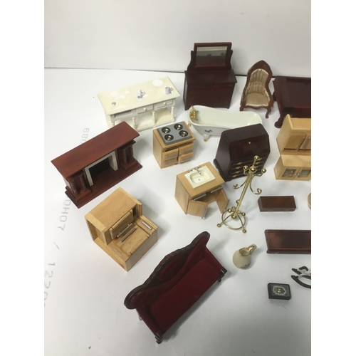 662 - A large amount of vintage dolls house furniture