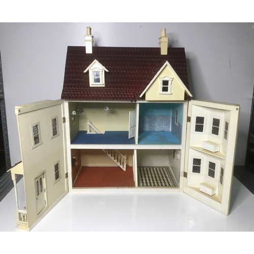 664 - A large vintage dolls house 73cm high