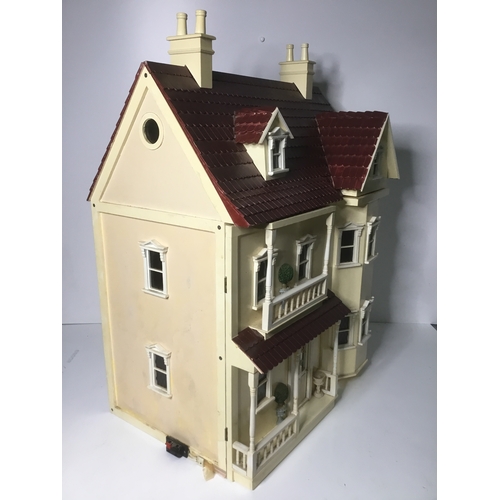 664 - A large vintage dolls house 73cm high