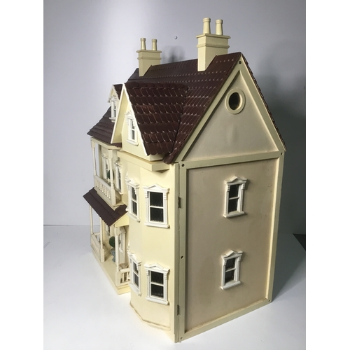 664 - A large vintage dolls house 73cm high