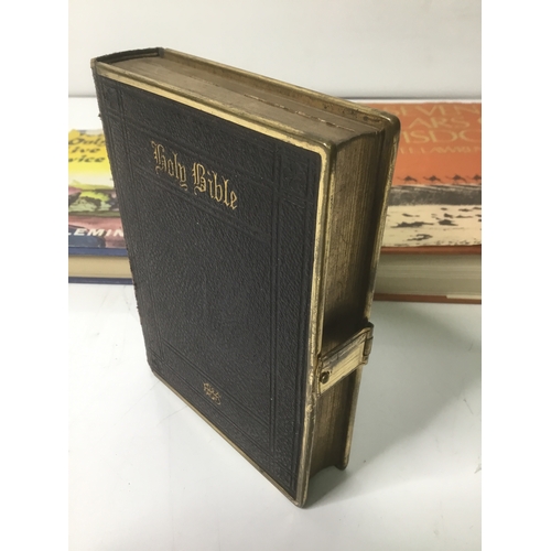 430 - Three books including Ian Fleming, T E Lawrence and an old brass bound bible