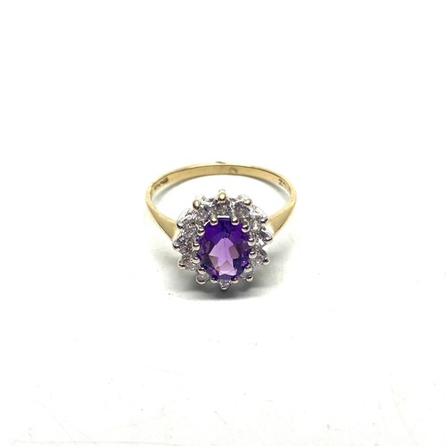 865 - 9ct gold cluster ring with a large Amethyst and CZ. Size P and 2.1g.