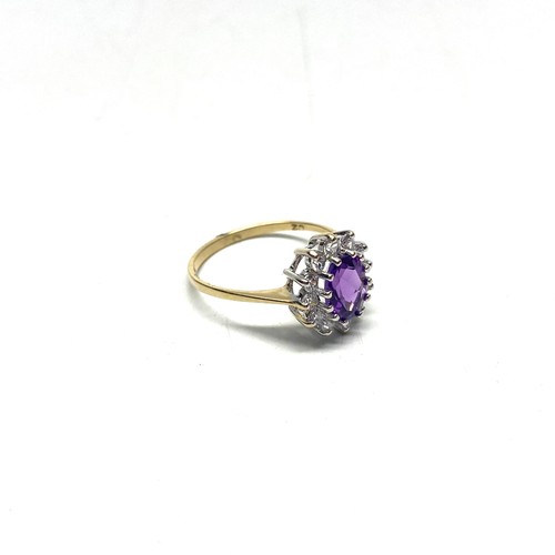 865 - 9ct gold cluster ring with a large Amethyst and CZ. Size P and 2.1g.