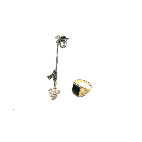 893 - Sterling silver signet ring size T and a silver three feathers charm on a chain.