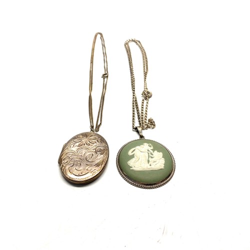 896 - Large silver locket and a Wedgewood style pedant and chain.