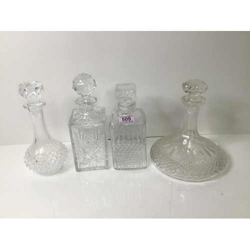 509 - Four cut glass decanters.