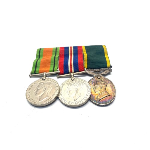 952 - Three medals awarded to: 4668025 C/Sjt A N Huntington. Defence Medal, 1939 - 1945 War Medal and Terr... 