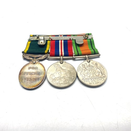 952 - Three medals awarded to: 4668025 C/Sjt A N Huntington. Defence Medal, 1939 - 1945 War Medal and Terr... 