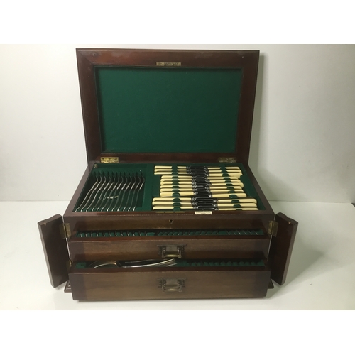 1102 - Large wooden cased cutlery set by Cross Bros Cardiff with original key and working lock