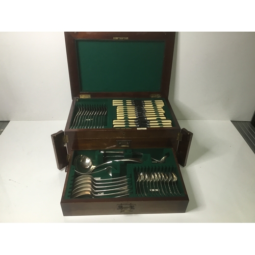 1102 - Large wooden cased cutlery set by Cross Bros Cardiff with original key and working lock