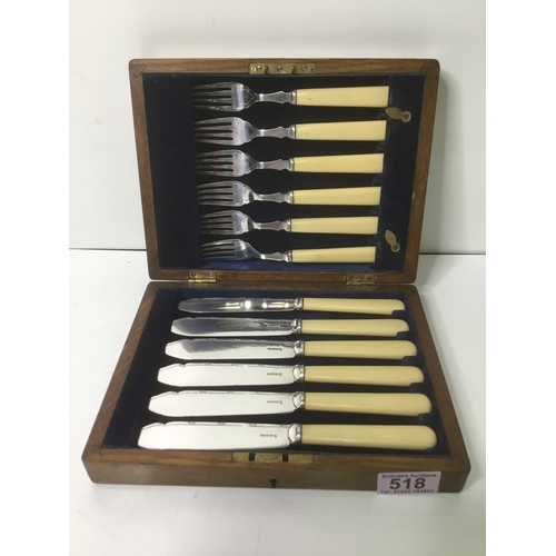 518 - A boxed set of silver plate fish knives and forks by H E and Co