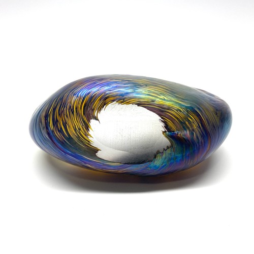 982 - Iridescent hand blown art glass paper weight in the shape of a stone by Lazlo.