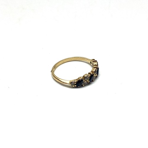 852 - 9ct gold ring with black sapphires and CZ. O and 1.7g.