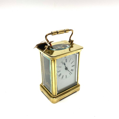 636 - Lovely heavy brass skeleton clock (working with key).