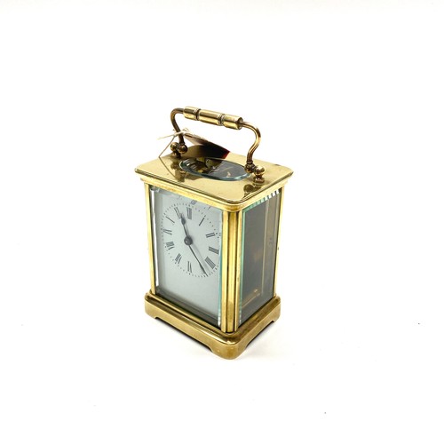 636 - Lovely heavy brass skeleton clock (working with key).