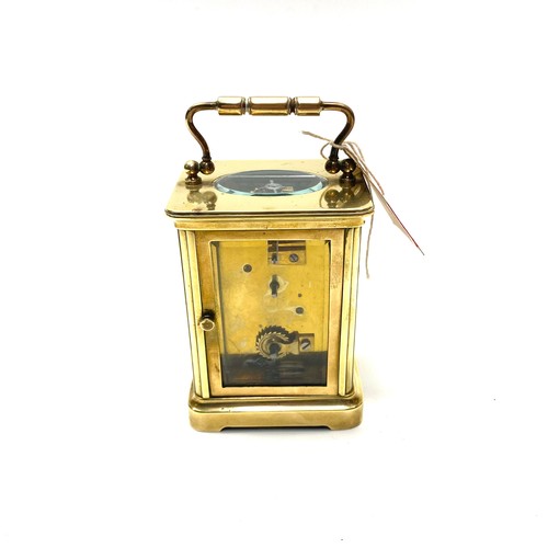 636 - Lovely heavy brass skeleton clock (working with key).