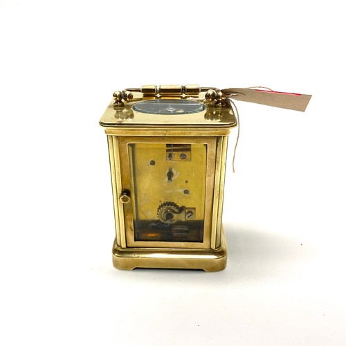 636 - Lovely heavy brass skeleton clock (working with key).