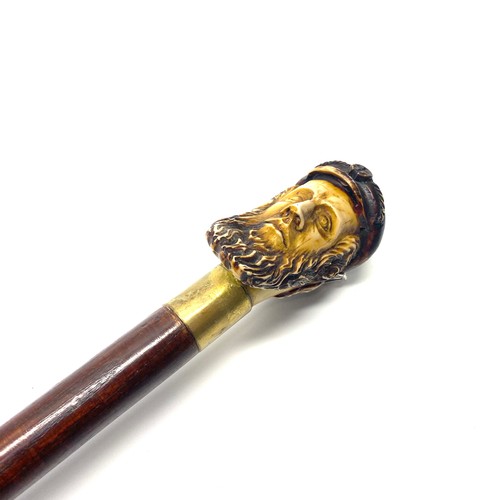 639 - Vintage walking cane with brass colliers and a hand carved sailors head handle.