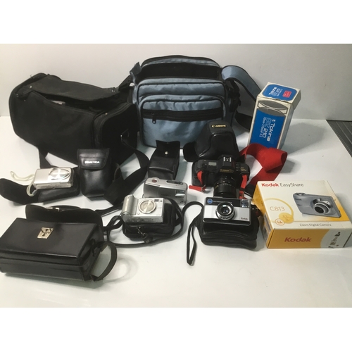 123 - A selection of cameras and equipment including a Canon T70