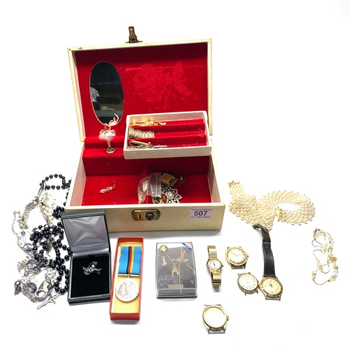 507 - Jewellery box containing brooches, watches, Jewellery, a medal and a silver filigree bracelet.