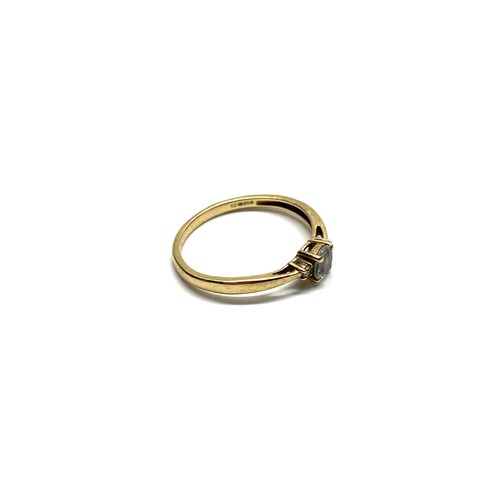 991B - 9ct gold ring with two diamonds to the shoulders and a blue topaz stone (MYOMU). Size P and 1.5g.