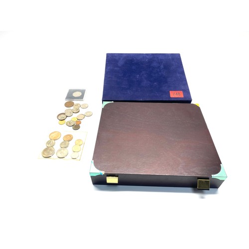 748 - Wooden and felt coin collection boxes and some coins.