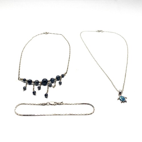 724 - Two silver necklaces and a bracelet